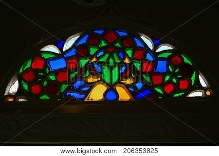 Window of colored glass of Dar al Hajar house tower at Wadi Dhahr Yemen