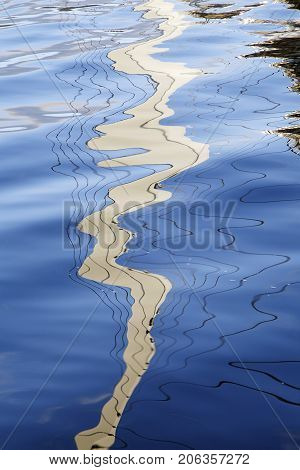 Reflections of Swansea's Millennium Footbridge in the Marina