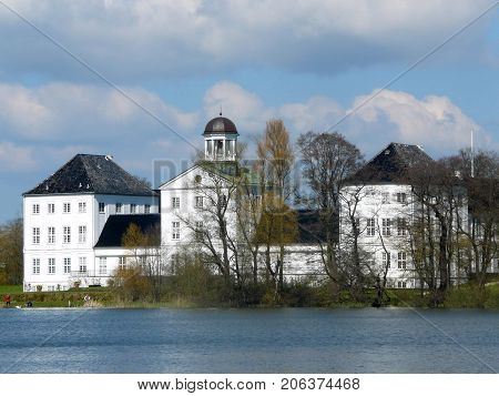 Graasten Denmark - April 19 2008: View across lake at summer residence of Danish queen