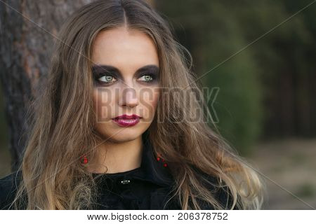 Portrait Of A Girl With Bright Make-up.