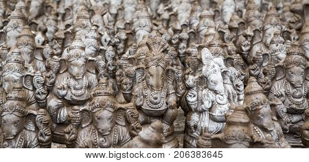 Many hand crafted Ganesha idol clay statues displayed in the market during Ganesh Festival.