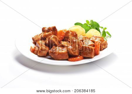 Goulash beef stew with potatoes, isolated on white background