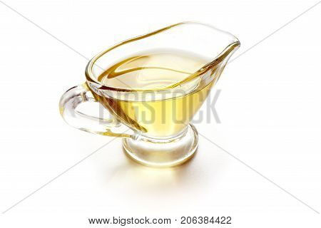 Cooking oil in gravy boat, isolated on white background