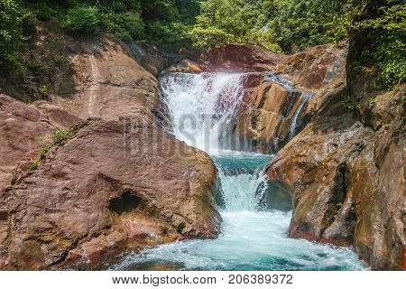 Beautiful waterfall with rocks Tharn Mayom Waterfall Koh Chang island in Trat Thailand