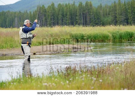 Fly-fisherman fishing in the Gallatin River, Montana