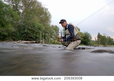 Fly-fisherman fishing in the Gallatin River, Montana
