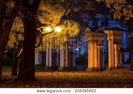 Night autumn view of illuminated St. Nicholas Naval Cathedral and Nikolskiy garden St. Petersburg Russia