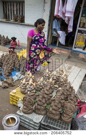 Close up of hand crafted Ganesha idol clay statues displayed in the market during Ganesh Festival.