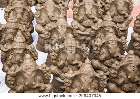 Many hand crafted Ganesha idol clay statues displayed in the market during Ganesh Festival.