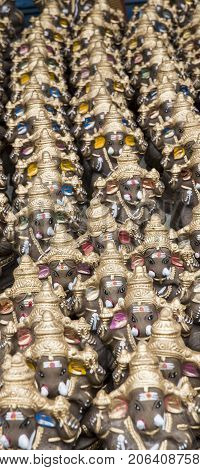 Many hand crafted Ganesha idol clay statues displayed in the market during Ganesh Festival.