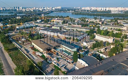 Aerial top view of industrial park zone from above, factory chimneys and warehouses, industry district in Kiev (Kyiv), Ukraine