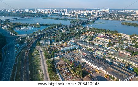 Aerial top view of industrial park zone from above, factory chimneys and warehouses, industry district in Kiev (Kyiv), Ukraine