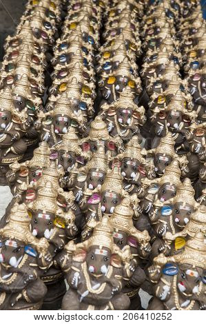 Many hand crafted Ganesha idol clay statues displayed in the market during Ganesh Festival.