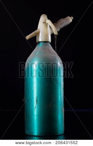 Old Dusty Siphon On Black Background. The Cobwebs Entwining The Old Siphon Into Soda Water.