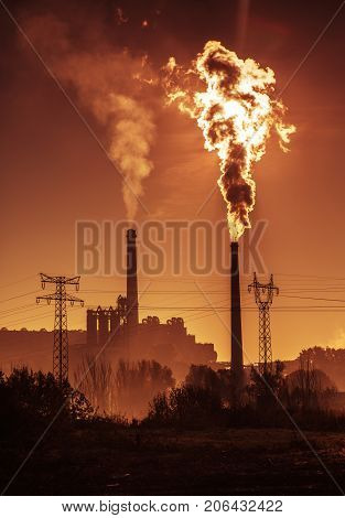 Power station with smoking chimney symbol of environmental pollution