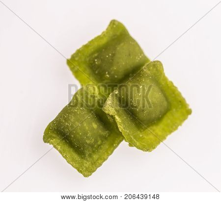 Raw handmade green agnolotti, type of ravioli, typical Italian egg pasta from Piedmont, Italy