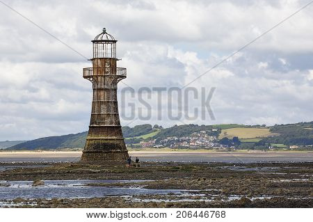 Gower, UK: August 10, 2017: Whiteford Lighthouse is listed by Cadw as Grade II. A wave-swept cast-iron lighthouse in British coastal waters and an important work of cast-iron architecture and nineteenth-century architecture.