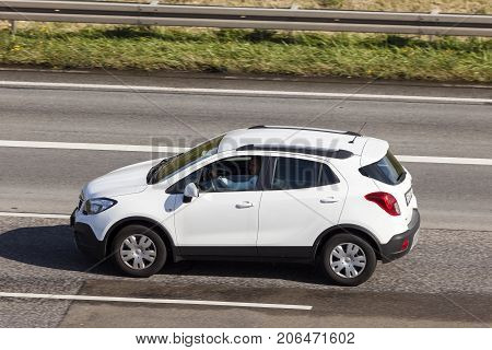 Frankfurt Germany - Sep 19 2017: White Opel Mokka compact crossover suv driving on the highway in germany
