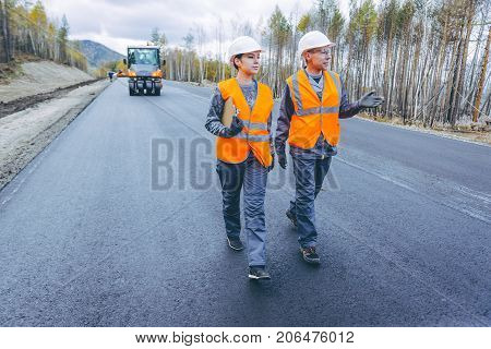roller road repair work pavement ashalt happy