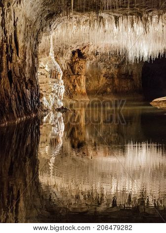 Huge cave with water reflection in france
