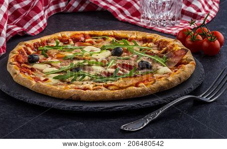 Pizza Tomato ham salad on dark background