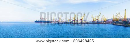 Panorama of the port. Sea. Ship. Cranes.