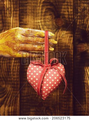 Female Hand Holding Valentine Heart