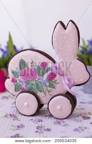 Easter gingerbread rabbit with wheels and roses with sugar icing