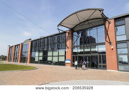 Swansea, UK: May 2016: The Bay Campus is located on the eastern approach to Swansea, and is the home to the College of Engineering and School of Management. Students enter the engineering building.
