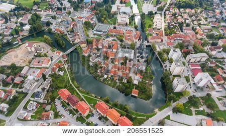 Top view of a river bend running through town. Kocevje, Slovenia.
