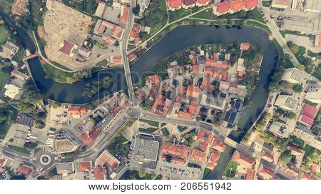 Top view of a river bend running through town. Kocevje, Slovenia.