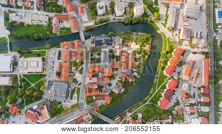 Top view of a river bend running through town. Kocevje, Slovenia.