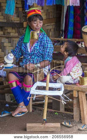 KAYAN STATE MYANMAR - SEP 09 : Portrait of Kayan tribe woman in Kayan state Myanmar on September 09 2017 Kayan tribe woman are well known for wearing neck rings.