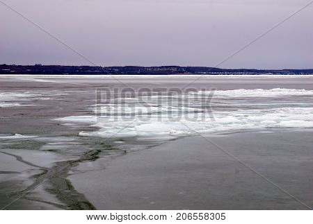 A view of ice-covered Little Traverse Bay, from the beach in Wequetonsing, Michigan, during March.