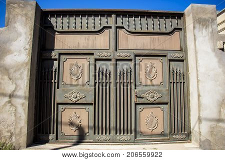 Iron gate to the entrance to the garden