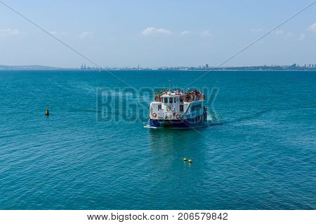 BURGAS BULGARIA - AUGUST 20 2017: Pleasure boats with tourists in the Burgas Bay. Burgas is the second largest city on the Bulgarian Black Sea Coast.