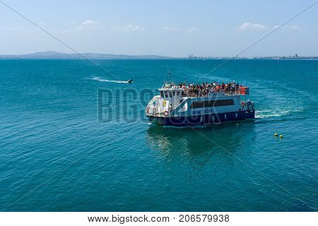 BURGAS BULGARIA - AUGUST 20 2017: Pleasure boats with tourists in the Burgas Bay. Burgas is the second largest city on the Bulgarian Black Sea Coast.