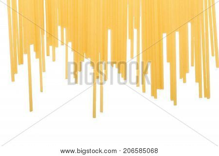 Uncooked long spaghetti isolated on a white background. Macaroni, spaghetti, pasta, noodles for gourmets. A pile of uncooked pasta. Healthful ingredients for nutritious lunches. Copy space.