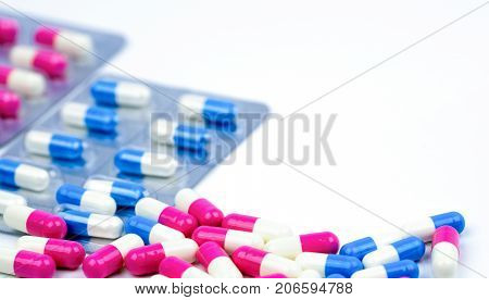 Colorful of antibiotic capsules pills selective focus on blur background with copy space. Drug resistance antibiotic drug use with reasonable health policy and health insurance concept.