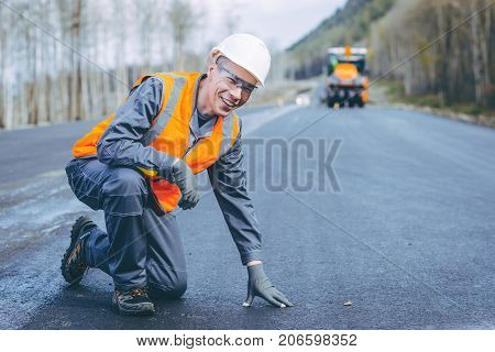 road worker construction repair asphalt highway build