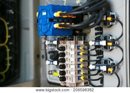 Electrical terminal in junction box and service by technician. Electrical device install in control panel for support program and control function by PLC. routine visit check equipment by technician.