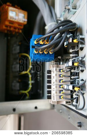 Electrical terminal in junction box and service by technician. Electrical device install in control panel for support program and control function by PLC. routine visit check equipment by technician.