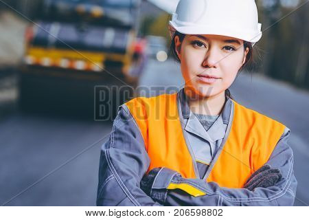 female worker road construction infrastructure repair pavement