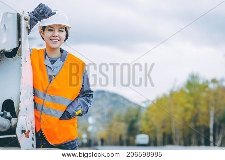 female worker road construction infrastructure repair pavement