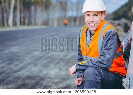 male worker road construction infrastructure repair pavement