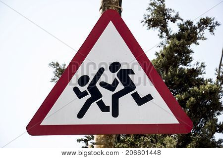 Road sign of running children through the bypass road