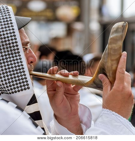 Jewish hasid blows Shofar. Uman Ukraine - 21 September 2017: Rosh Hashanah Jewish New Year.