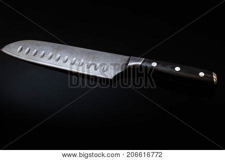 Knife isolated on a black background  with a spotlight on it