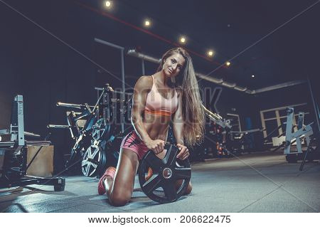 Sexy Athletic Young Girl Training Back In Gym