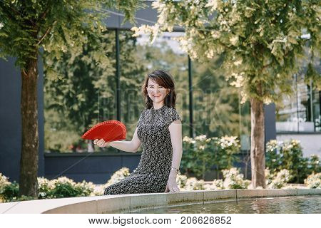 A Young Girl Walks In An Old Park.
